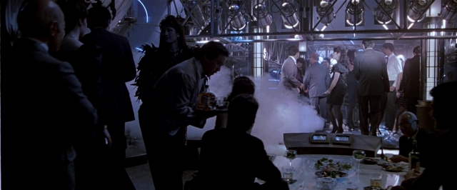 Wide shot frame from Black Rain — sitting, standing, room