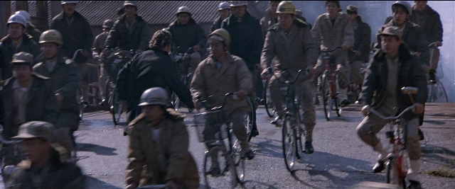 Wide shot frame from Black Rain — walking, dialogue, street