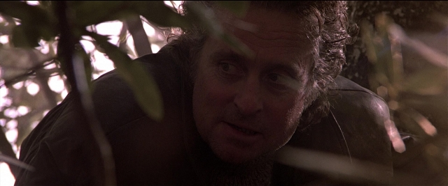Close-up frame from Black Rain — face, hair, person