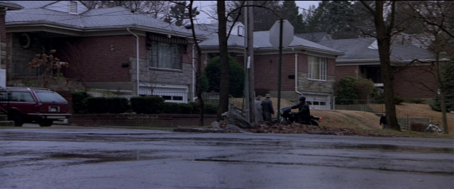 Frame from Black Rain — sitting, standing, walking