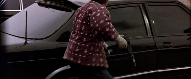 Frame from Black Rain — standing, door, car