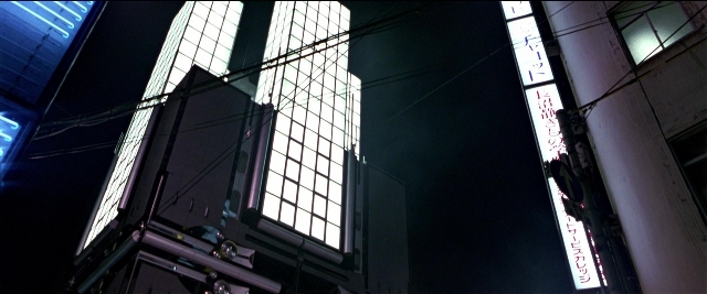 Wide shot frame from Black Rain — night, glass, window