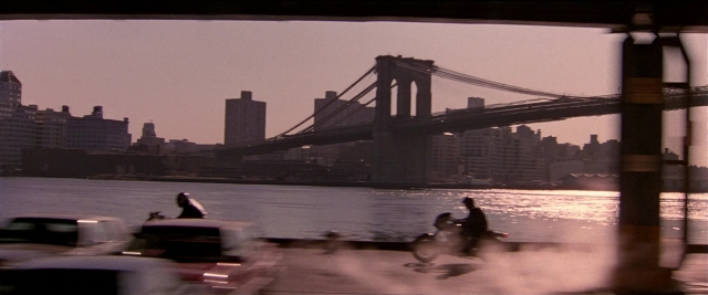 Frame from Black Rain — car, water, skyscraper