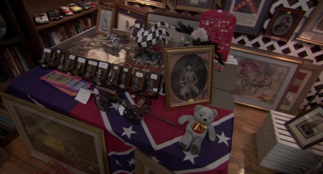 Wide shot frame from Borat: Cultural Learnings of America for Make Benefit Glorious Nation of Kazakhstan — room, table, bookcase