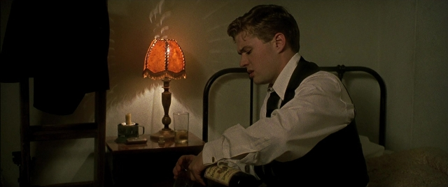 Frame from Gosford Park — sitting, book, room