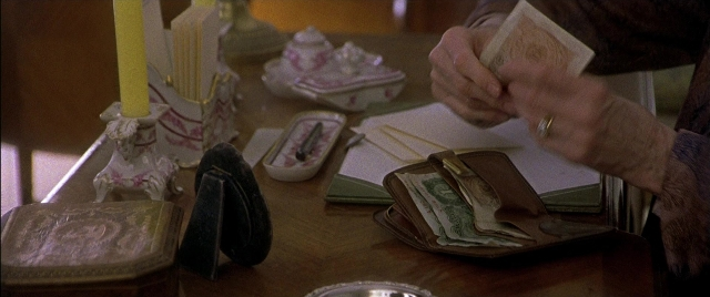 Wide shot frame from Gosford Park — sitting, plate, table