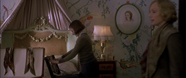 Wide shot frame from Gosford Park — book, standing, room