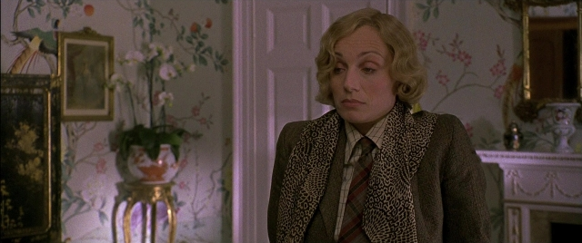 Medium shot frame from Gosford Park — standing, room, mirror