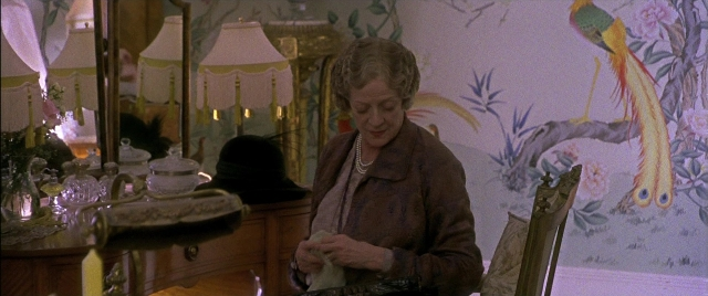 Wide shot frame from Gosford Park — sitting, room, table