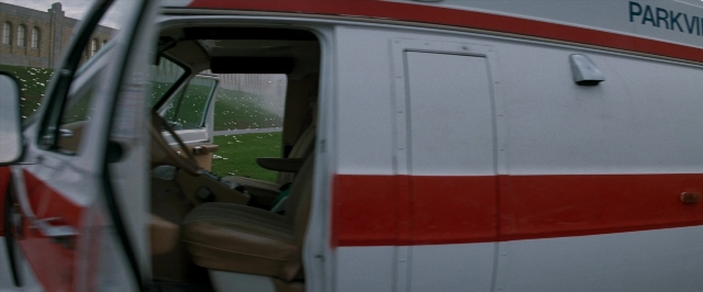 Frame from In the Mouth of Madness — door, van