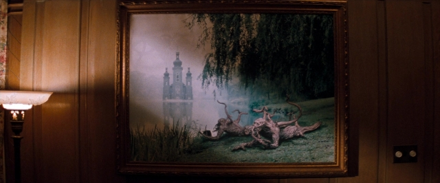 Wide shot frame from In the Mouth of Madness — room, water, lamp