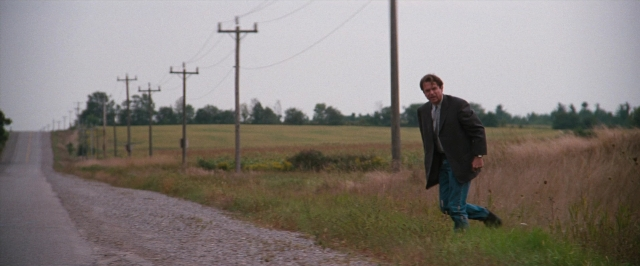 Frame from In the Mouth of Madness — people, action, show