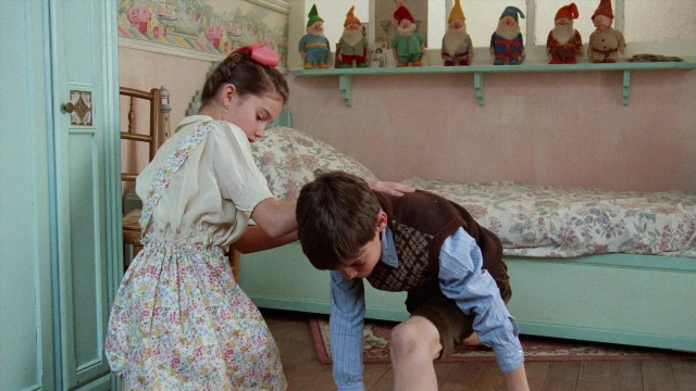 Wide shot frame from In the Mouth of Madness — standing, room, bed