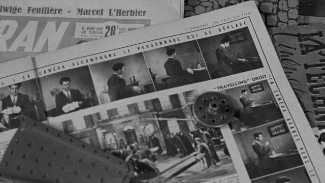 Wide shot frame from In the Mouth of Madness — people, action, group