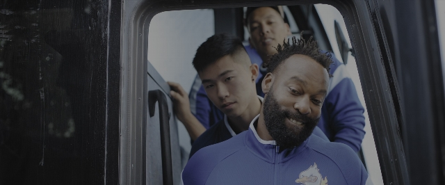 Wide shot frame from Joy Ride — standing, beard, bird
