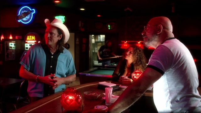 Wide shot frame from Kill Bill: Vol. 2 — standing, table, dialogue