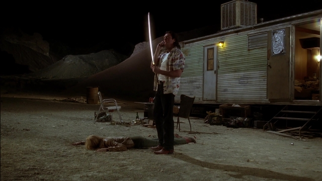 Wide shot frame from Kill Bill: Vol. 2 — standing, table, dialogue