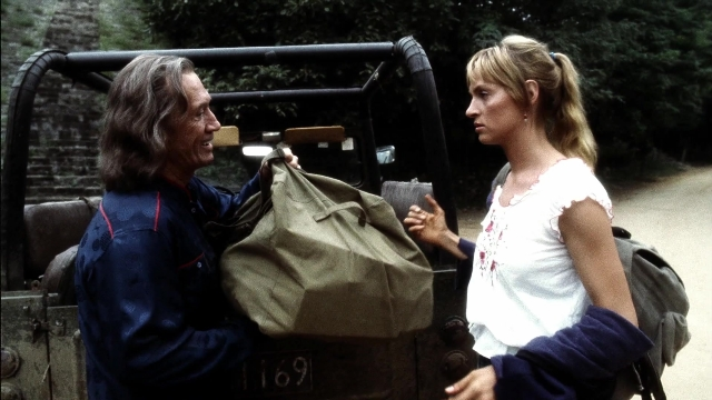 Wide shot frame from Kill Bill: Vol. 2 — standing, hand, face