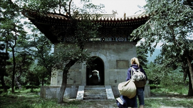 Wide shot frame from Kill Bill: Vol. 2 — walking, bag, person