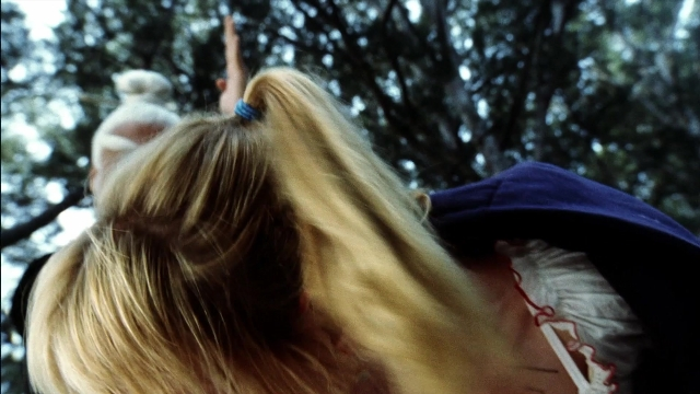 Wide shot frame from Kill Bill: Vol. 2 — walking, hat, hair