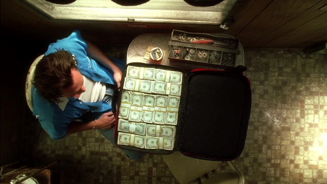 Wide shot frame from Kill Bill: Vol. 2 — sitting, room, table