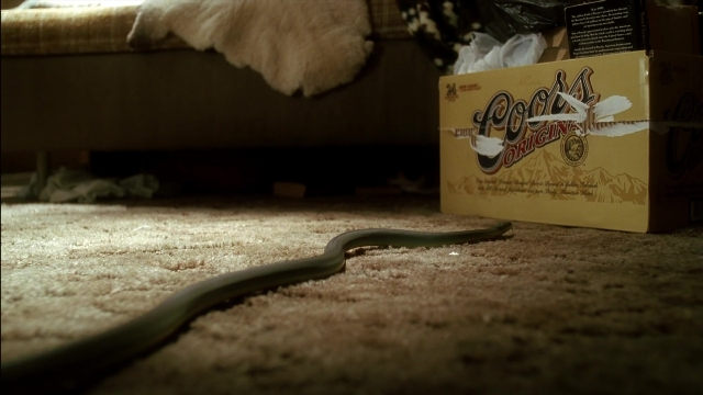 Frame from Kill Bill: Vol. 2 — room, couch, box