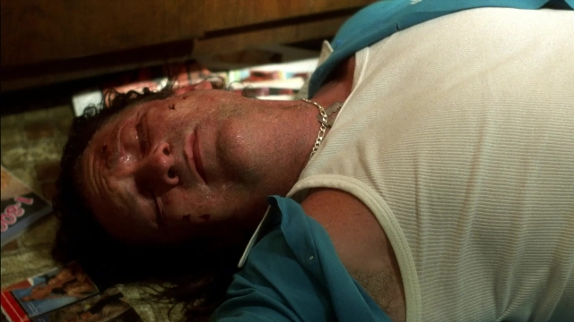 Wide shot frame from Kill Bill: Vol. 2 — room, bed, hat