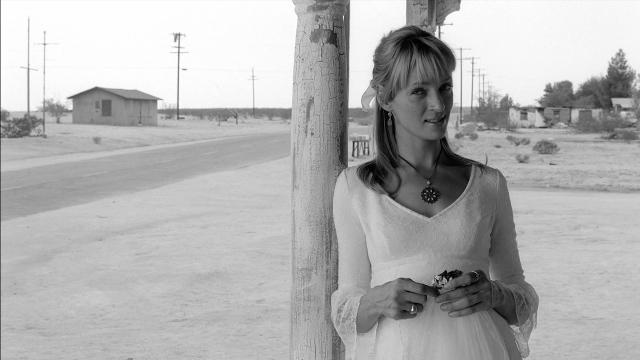 Frame from Kill Bill: Vol. 2 — standing, street, dress