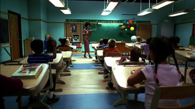 Wide shot frame from Kill Bill: Vol. 2 — sitting, book, standing