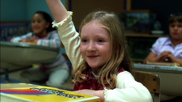Medium shot frame from Kill Bill: Vol. 2 — sitting, dress, face