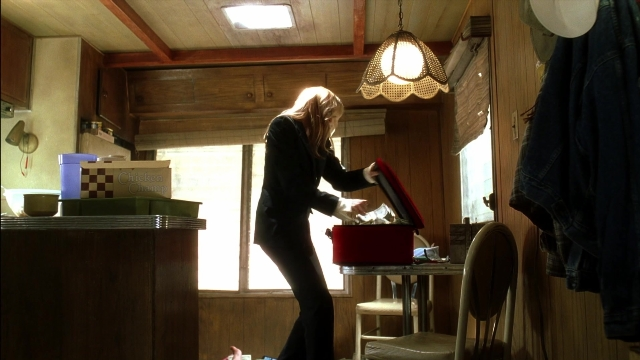 Wide shot frame from Kill Bill: Vol. 2 — standing, table, kitchen
