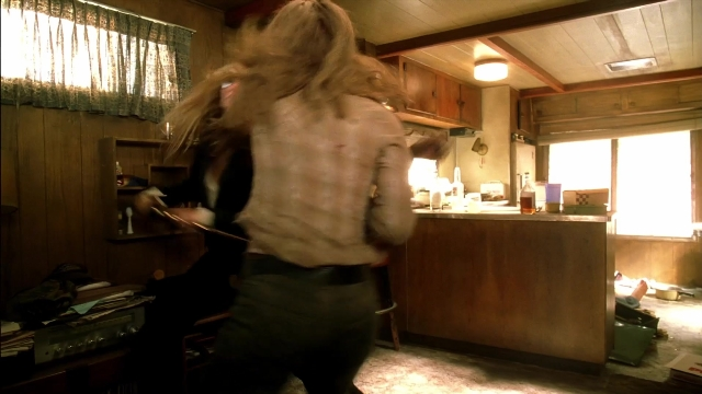 Wide shot frame from Kill Bill: Vol. 2 — standing, kitchen, house