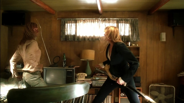 Wide shot frame from Kill Bill: Vol. 2 — standing, room, phone