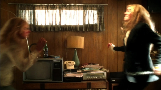 Wide shot frame from Kill Bill: Vol. 2 — standing, room, phone