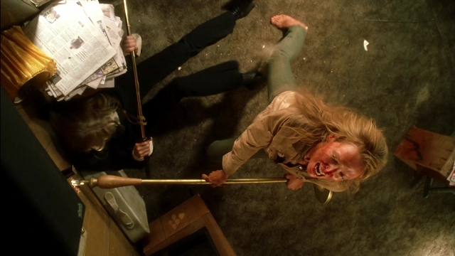 Frame from Kill Bill: Vol. 2 — room, shirt, newspaper