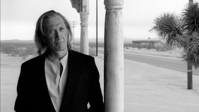 Wide shot frame from Kill Bill: Vol. 2 — standing, street, suit
