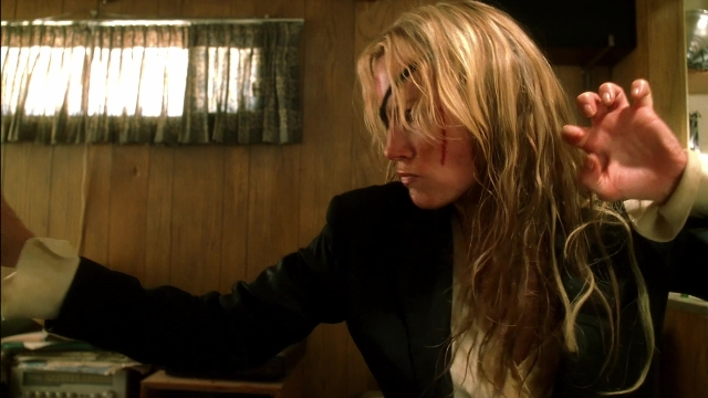 Wide shot frame from Kill Bill: Vol. 2 — standing, room, hand