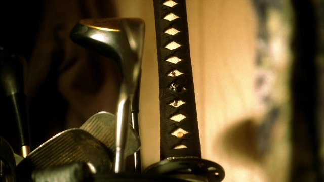 Wide shot frame from Kill Bill: Vol. 2 — face, sword, person