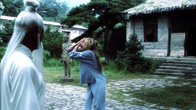 Wide shot frame from Kill Bill: Vol. 2 — standing, house, person