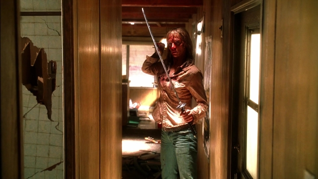 Wide shot frame from Kill Bill: Vol. 2 — standing, room, door