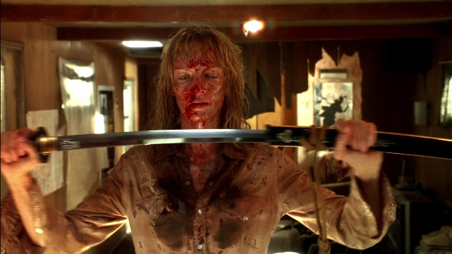 Wide shot frame from Kill Bill: Vol. 2 — room, hand, shirt