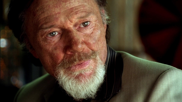 Wide shot frame from Kill Bill: Vol. 2 — room, shirt, beard