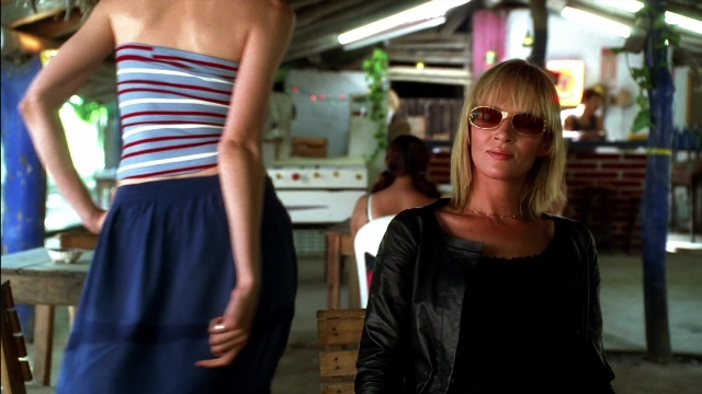 Wide shot frame from Kill Bill: Vol. 2 — sitting, standing, restaurant