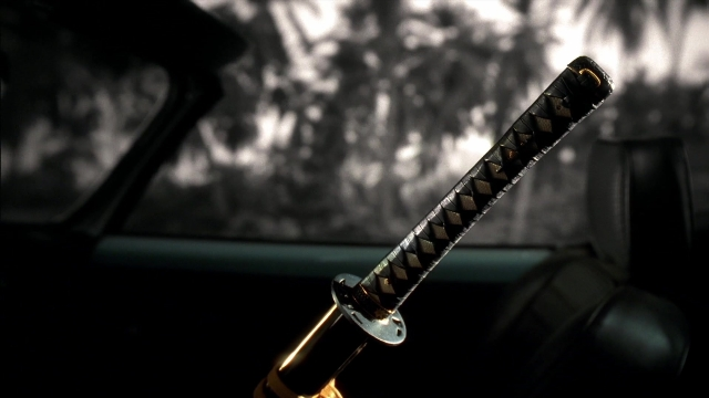 Wide shot frame from Kill Bill: Vol. 2 — car, sword
