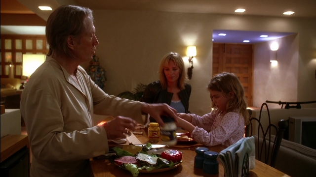 Wide shot frame from Kill Bill: Vol. 2 — sitting, standing, plate