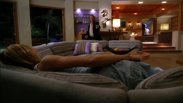 Wide shot frame from Kill Bill: Vol. 2 — standing, room, table