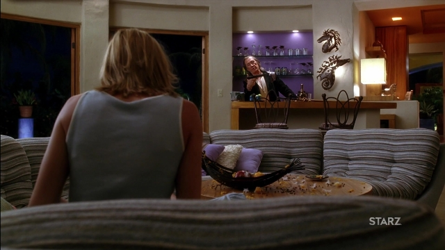 Wide shot frame from Kill Bill: Vol. 2 — sitting, room, table