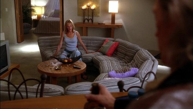 Wide shot frame from Kill Bill: Vol. 2 — sitting, room, table