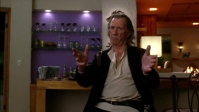 Wide shot frame from Kill Bill: Vol. 2 — sitting, room, table
