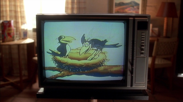 Wide shot frame from Kill Bill: Vol. 2 — sitting, room, television